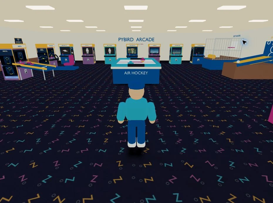 Actual playable Pybird room with Jo, the central hockey table and illustrated cabinets